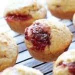 These easy muffins filled with jam are the perfect quick breakfast! I like to eat one or two in the morning with a piping hot cup of coffee. It's such an easy recipe to make that you can make a batch when you wake up. Also, they are perfect for farmer's market preserves and jams! | honeyandbirch.com