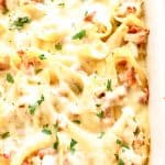 chicken bacon Alfredo stuffed shells in a white casserole dish