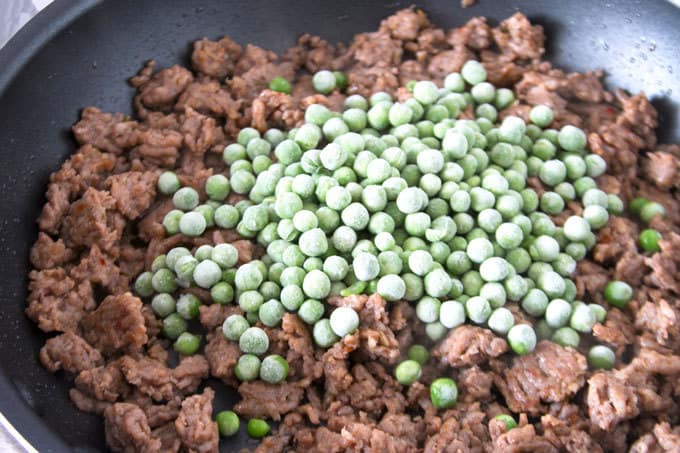frozen peas and cooked Italian sausage