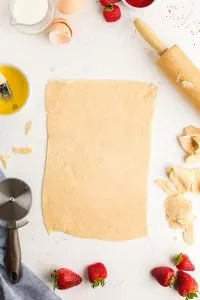 pop tarts dough rolled out and the edges cut off with a pizza cutter to create a rectangle