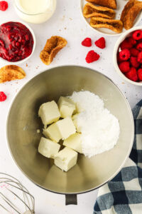 butter and confectioners sugar in a stand mixer bowl